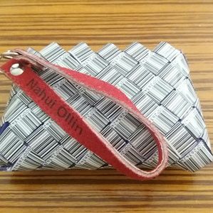 Wristlet with red leather strap